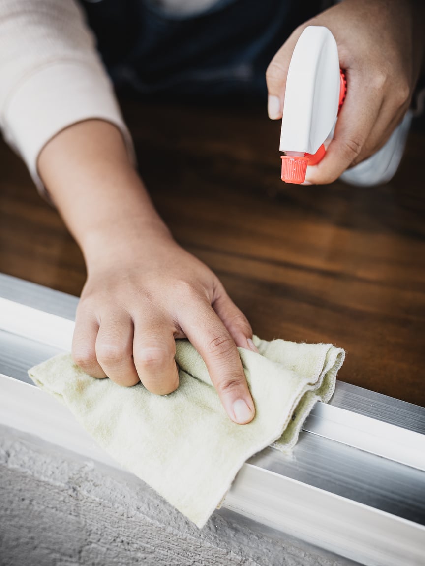 Cleaner Spraying and Wiping Window Sill